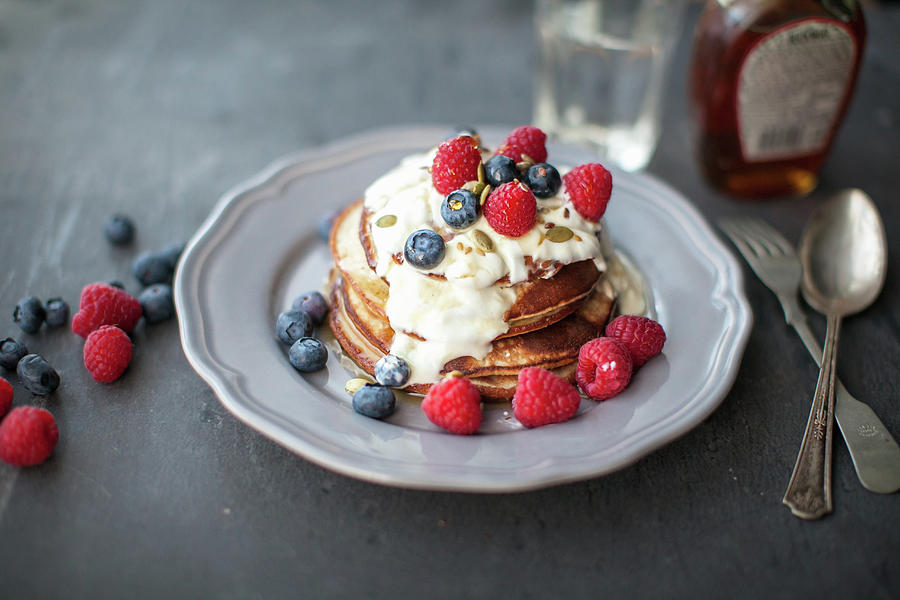 Gluten-free Banana Pancakes With Raspberries And Blueberries Photograph by Lara Jane Thorpe
