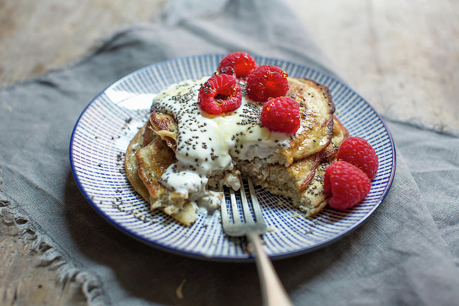 Gluten-free Banana Pancakes With Raspberries And Chia Seeds Photograph by Lara Jane Thorpe