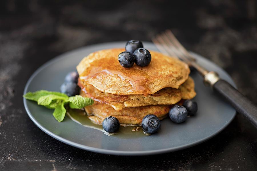 Gluten-free Lupin Pancakes With Maple Syrup And Blueberries Photograph by Jan Wischnewski