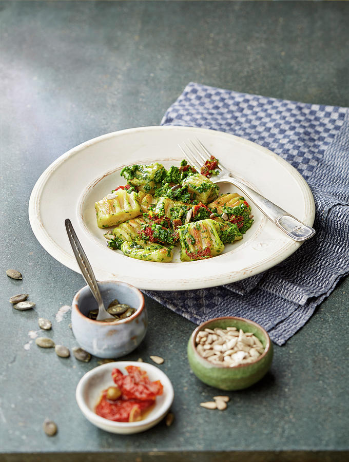 Gnocchi With Spinach Pesto And Dried Tomatoes Photograph by Meike Bergmann