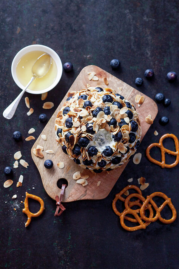 Goats Cheese Ball With Blueberries, Honey And Pretzels Photograph by Akiko Ida