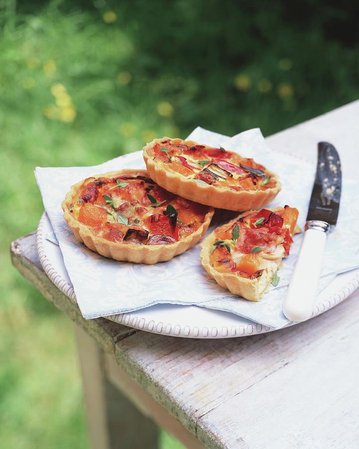Goats Cheese Tartlets With Oven-roasted Vegetables For A Picnic Photograph by Jonathan Gregson