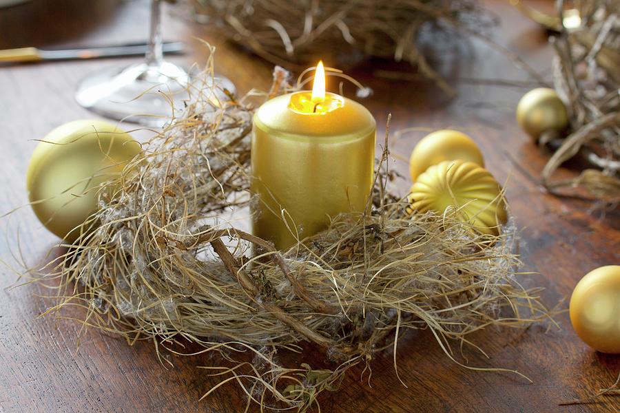 Gold Candle In Dried Wreath On Wooden Table Decorated With Christmas Baubles Photograph by Angela Francisca Endress