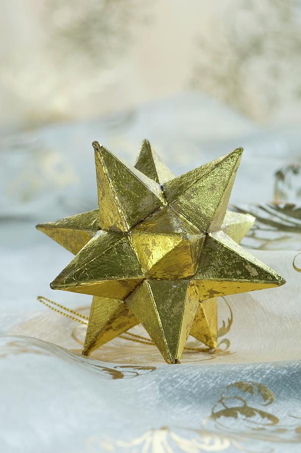 Gold Star Christmas Decoration Photograph by Achim Sass