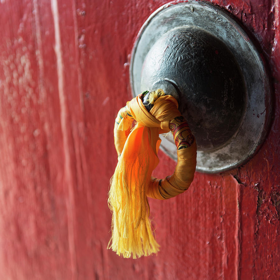 Gold Tassel Tied To A Doorknob On A Red Photograph by Keith Levit / Design Pics