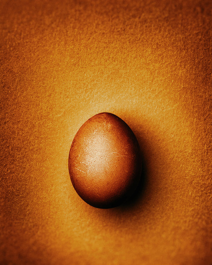 Golden Easter Egg On A Gold-colored Background Photograph by Peter Rees