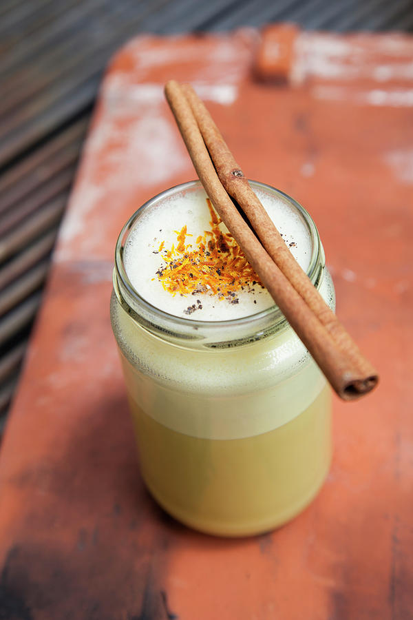 Golden Milk With Turmeric And A Cinnamon Stick Photograph by Julia Skowronek