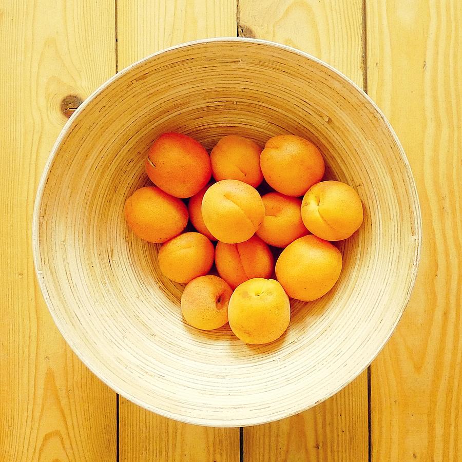 Golden Orange Apricots In Wooden Bowl Photograph by Dorte Fjalland