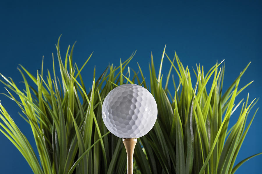 Golf ball on tee Photograph by Deborah Ritch