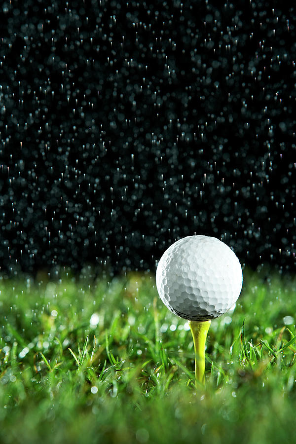 Golf Ball On Tee In Rain Photograph by Thomas Northcut