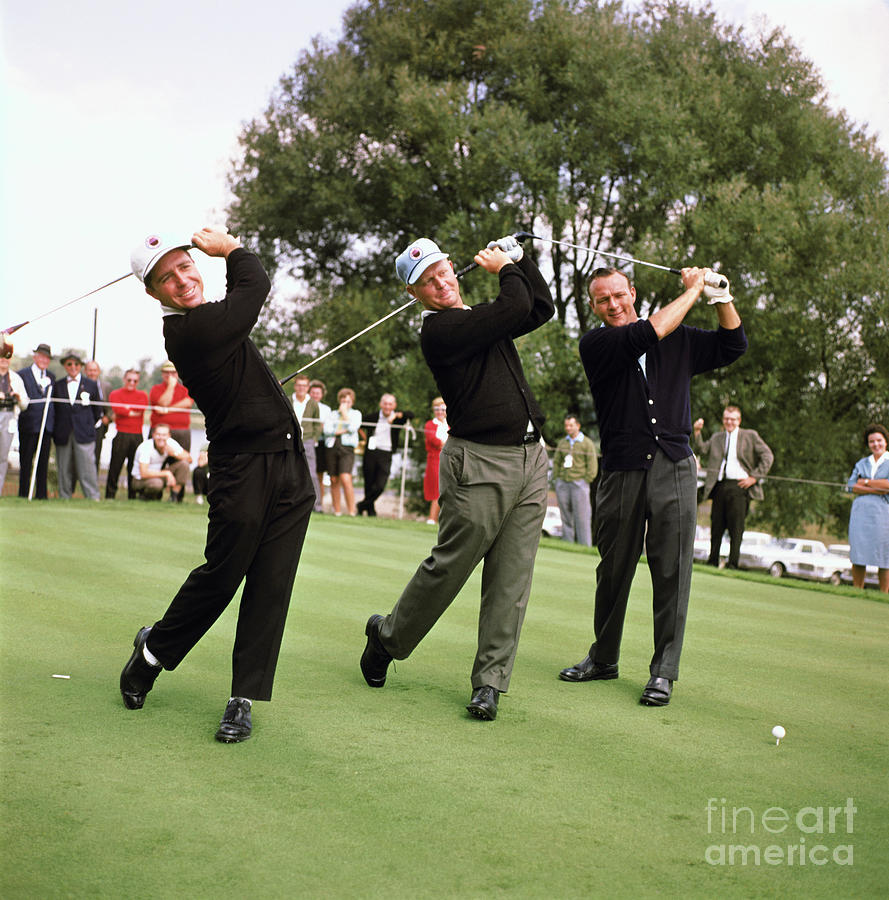 Golfers Swinging Clubs Photograph by Bettmann