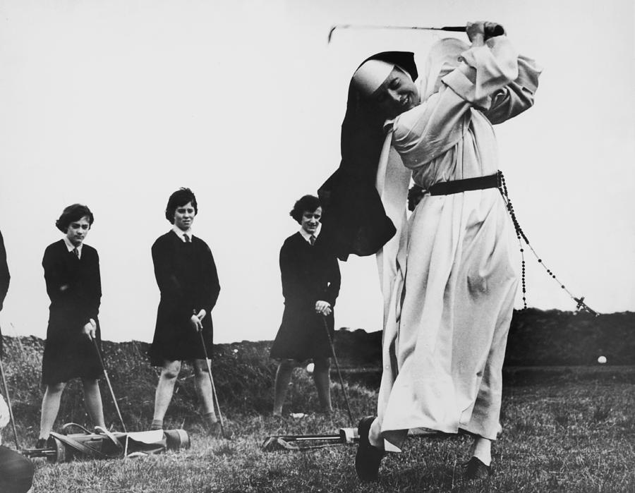 Golfing Nun Photograph by Central Press