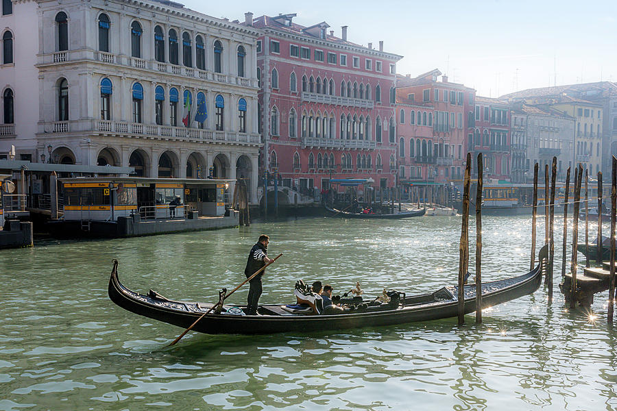 Gondolier on the Grand Canal in Venice Photograph by Wolfgang Stocker