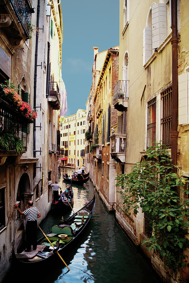 Gondoliers And Gondolas On Canal In Photograph by Medioimages/photodisc