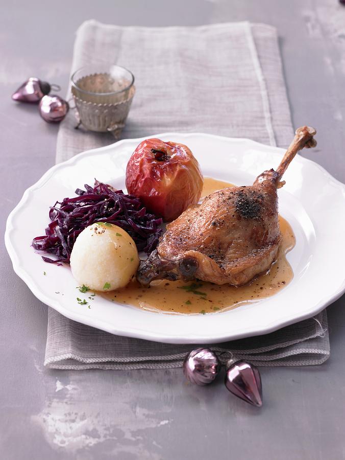 Goose Leg With A Baked Apple, Red Cabbage And A Potato Dumpling Photograph by Nikolai Buroh