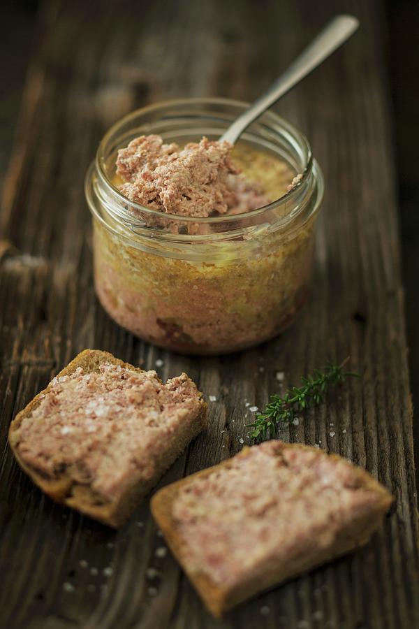 Goose Liver Pt In A Jar And On Slices Of Bread Photograph by Jan Wischnewski