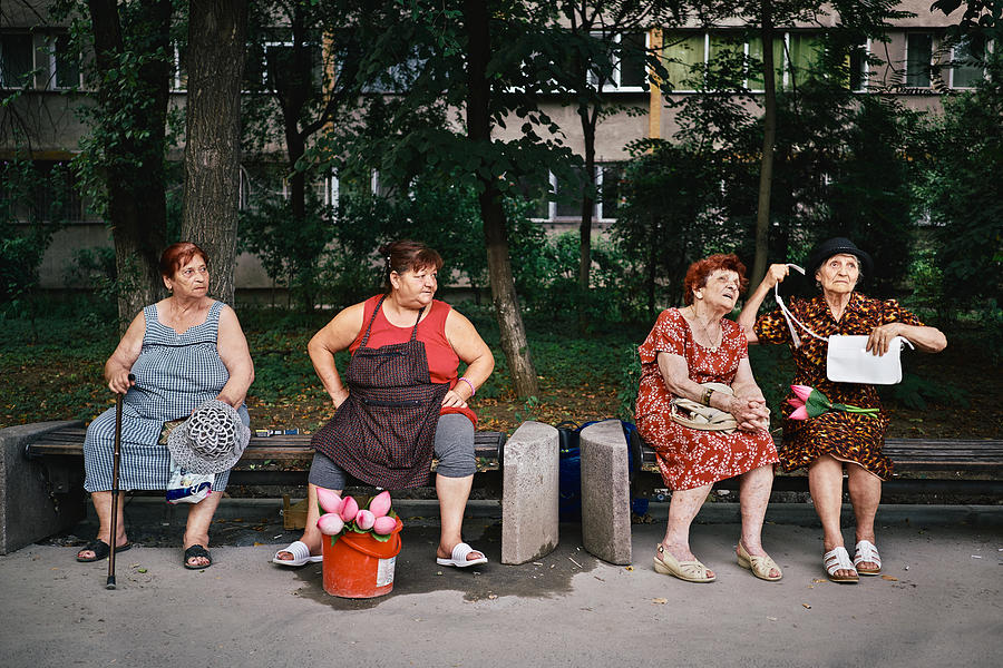 Street Photograph - Gossiping Grandmas by Denis Malciu