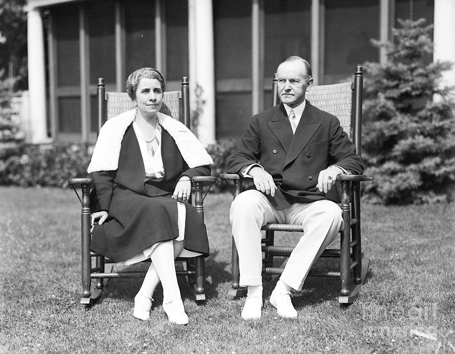 Grace And Calvin Coolidge Seated On Lawn Photograph by Bettmann