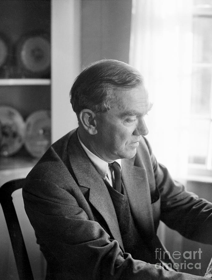 Graham Greene Sitting At Desk Photograph by Bettmann