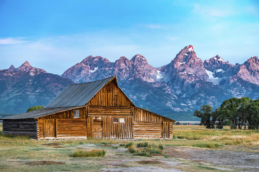 Grand Teton scenic view with abandoned barn on Mormon Row Photograph by Alex Grichenko
