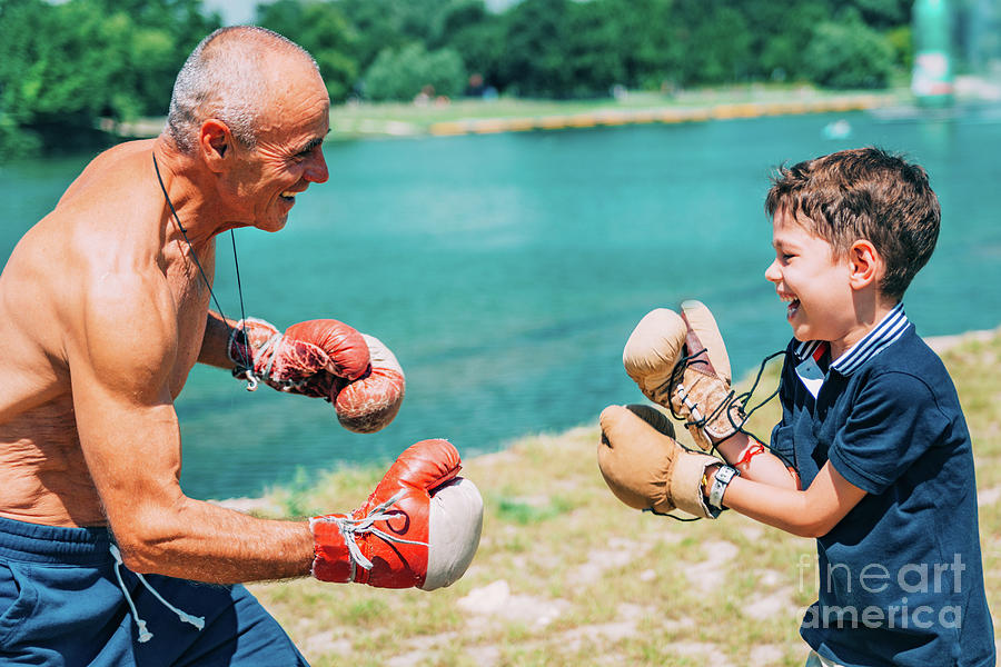 Grandfather And Grandson Boxing Photograph by Microgen Images/science Photo Library
