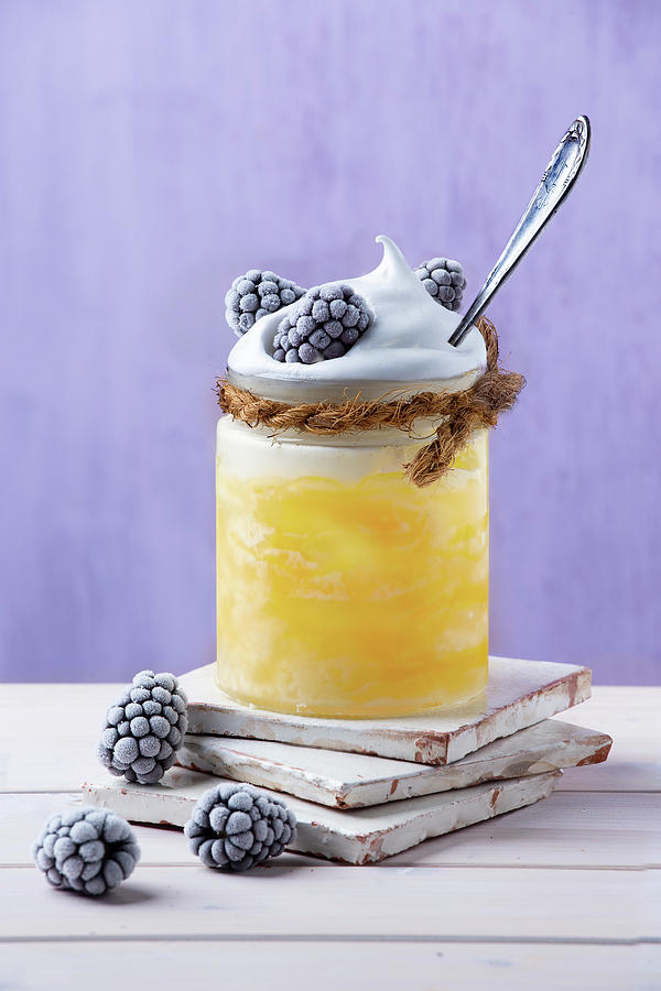 Granita Di Limone With A Soft Meringue Topping And Frozen Blackberries Photograph by Christian Schuster
