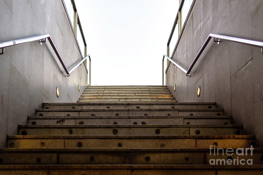 Granite staircase with handrails at the entrance of an underground pedestrian tunnel. Photograph by Joaquin Corbalan