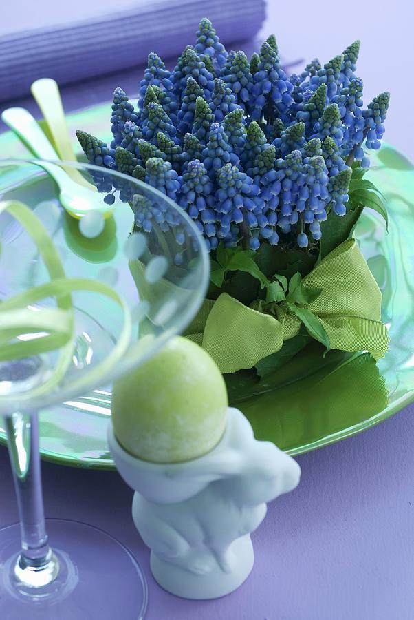Grape Hyacinths And Easter Egg In Egg Cup Photograph by Matteo Manduzio