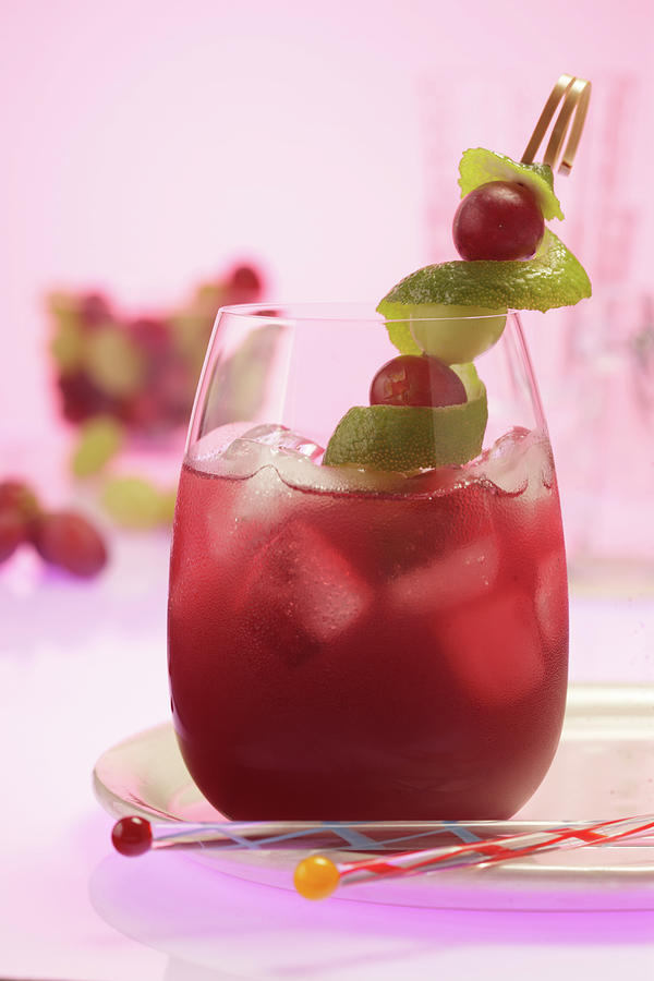 Grape Juice Spritz With Lime Zest Photograph by Uwe Bender