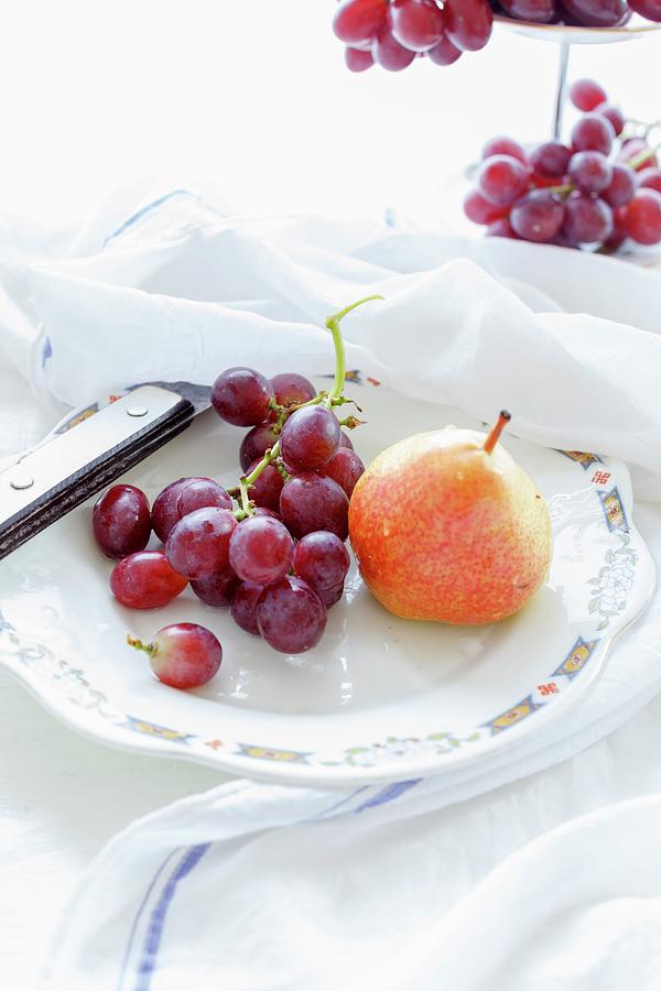 Grapes And Pears On A Plate Photograph by Sandhya Hariharan