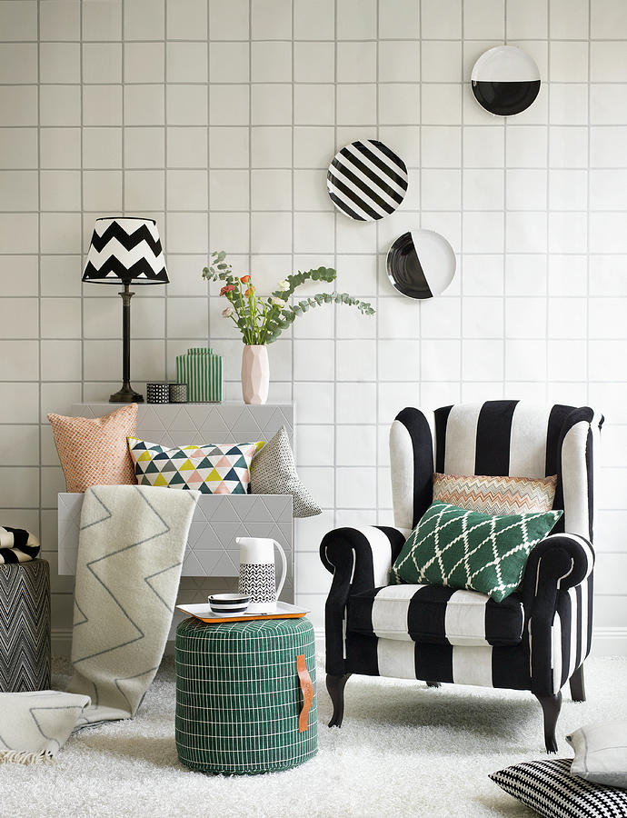 Graphic Design: Black-and-white Striped Armchair, Stool, Shelves, Cushions, Decorative Wall Plates And Tile-effect Wallpaper Photograph by Anderson Karl