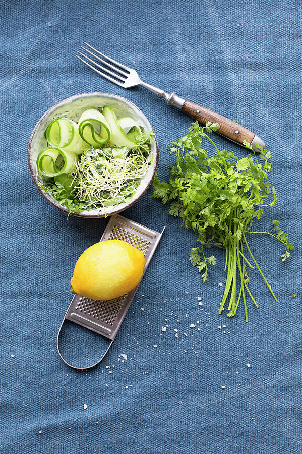 Grated Cucumber, Onion Shoots, Lemon With A Grater And Chervil Photograph by Tina Engel