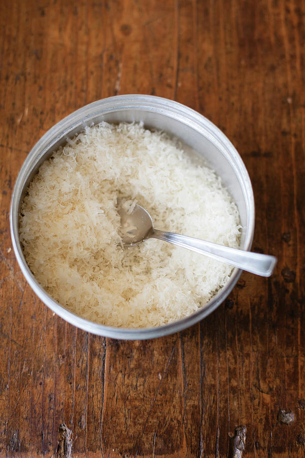 Grated Parmesan In A Bowl With A Spoon Photograph by Eising Studio