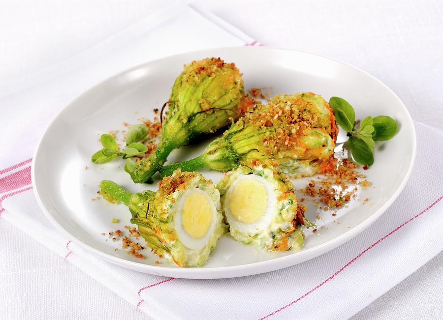Gratinated Courgette Flowers Filled With Eggs Photograph by Franco Pizzochero