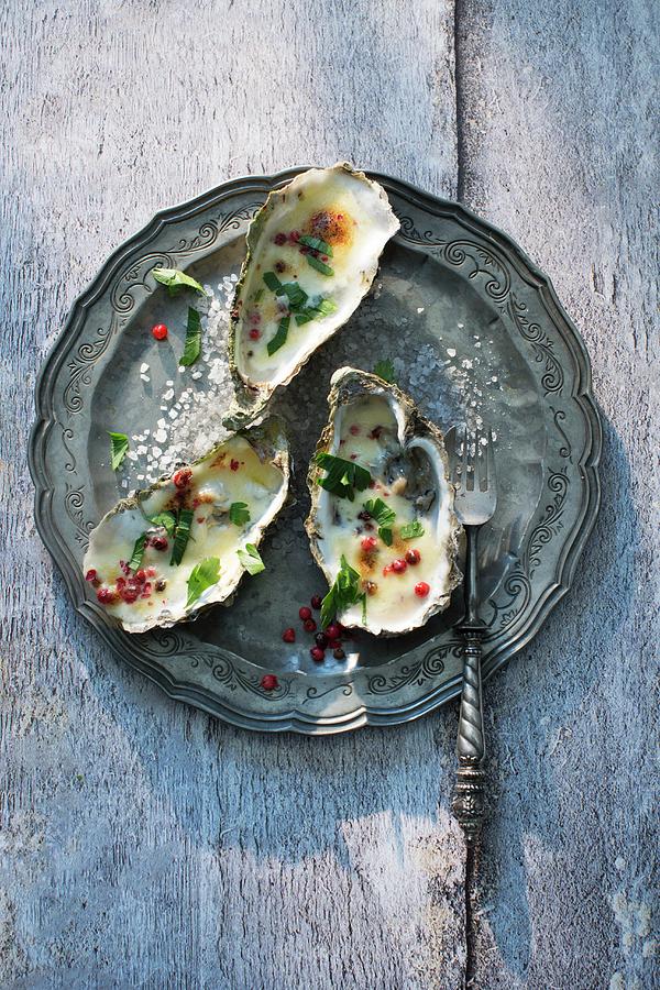 Gratinated Oysters With Pink Pepper Photograph by Joerg Lehmann