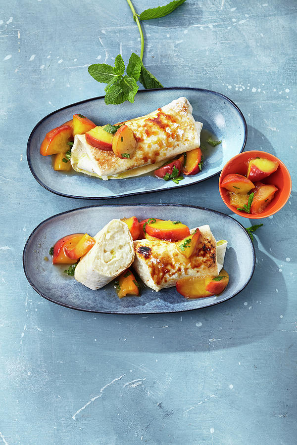 Gratinated Wraps Filled With Rice Pudding And Peaches Photograph by Stockfood Studios /  Ulrike Holsten