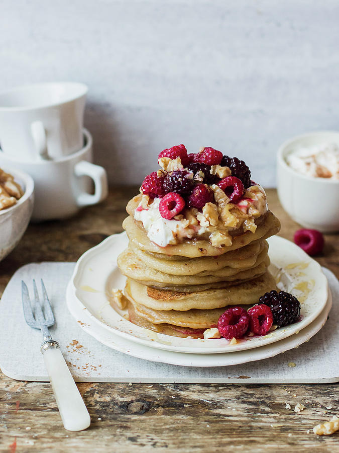 Greek Pancakes With Yogurt, Raspberries, Blackberries, Walnuts And Honey Photograph by Zuzanna Ploch
