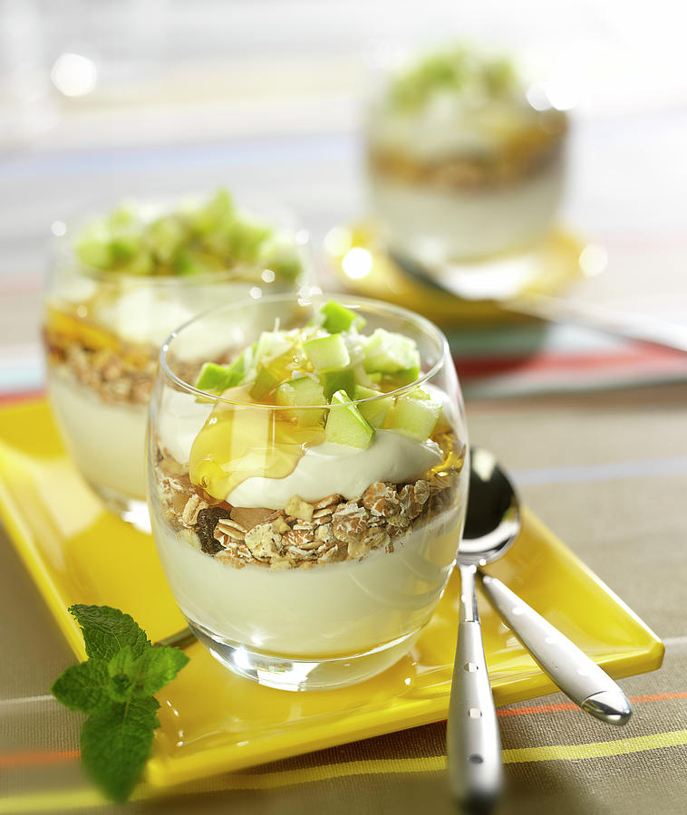 Greek Yoghurt, Muesli, Diced Apple, Honey And Walnut Pudding Topped With Grated Coconut Photograph by Bertram