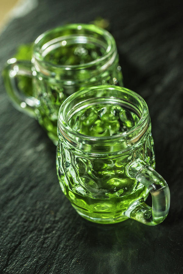 Green Absinthe In Glasses With Handles Photograph by Chris Schfer