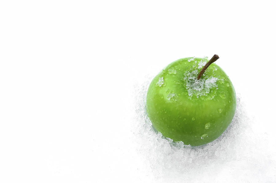 Green Apple and Snow Photograph by Tatiana Travelways