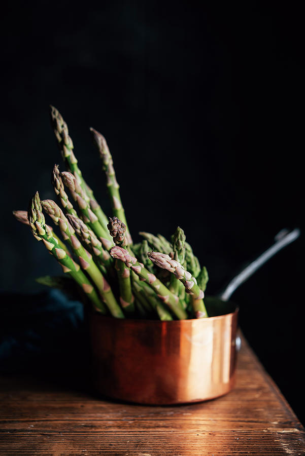 Green Asparagus In A Copper Pot Photograph by Justina Ramanauskiene