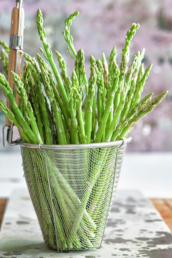 Green Asparagus In A Deep-frying Basket Photograph by Lerner, Danny