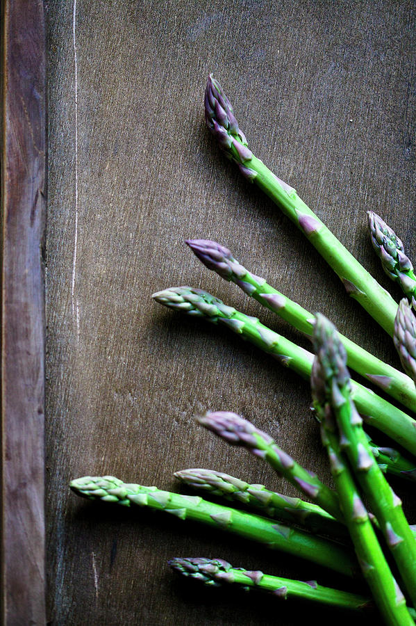 Green Asparagus On A Wooden Background Photograph by Karen Thomas