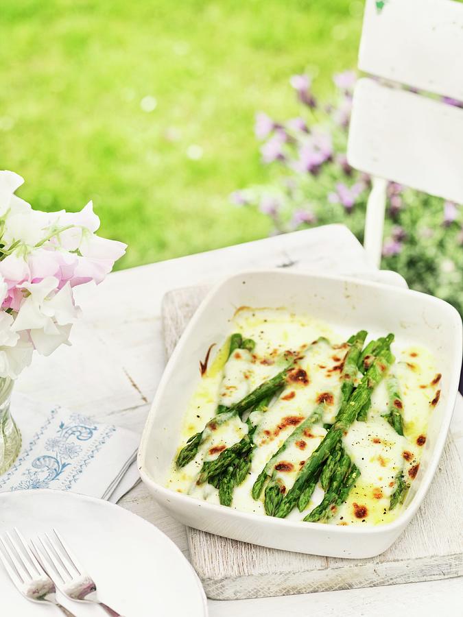 Green Asparagus Topped With Melted Cheese Photograph by Jonathan Gregson