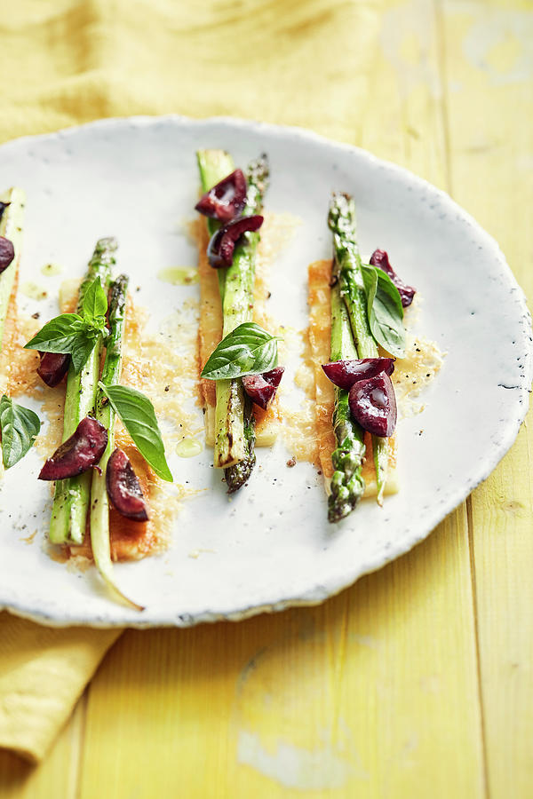 Green Asparagus With Cherries, Basil And Parmesan Puff Pastry Photograph by Thorsten Stockfood Studios / Suedfels