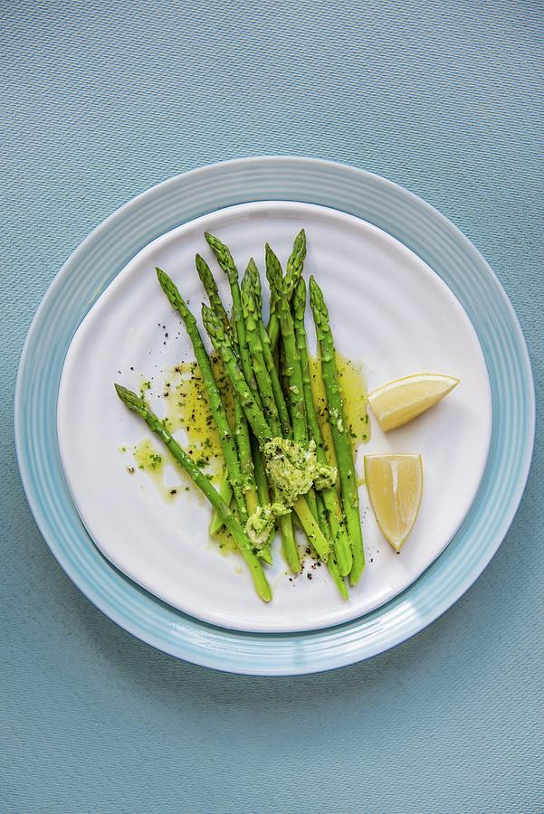 Green Asparagus With Garlic Herb Butter And Lemon Photograph by Magdalena Hendey