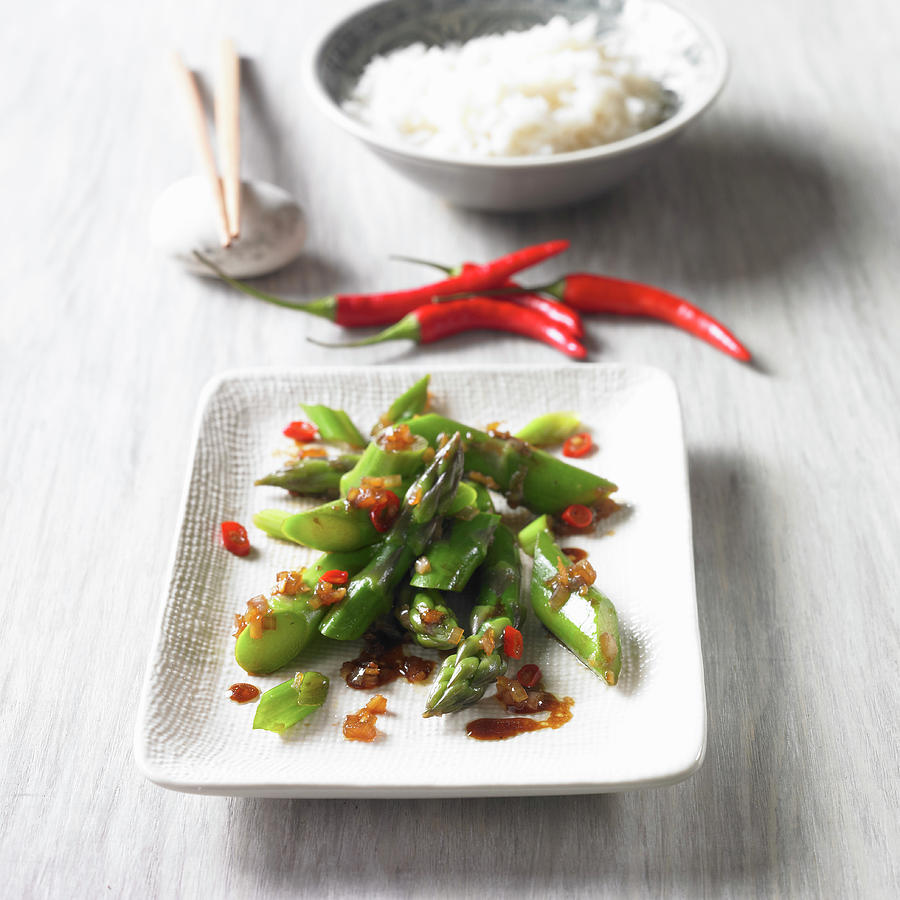 Green Asparagus With Glazed Onions And Chilli Photograph by Brigitte Wegner