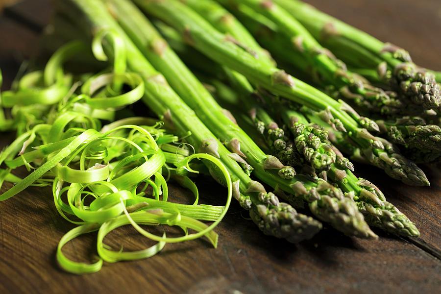 Green Asparagus With Peelings Photograph by Nicole Godt