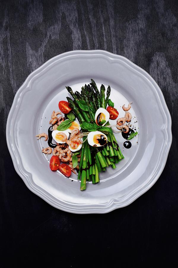 Green Asparagus With Quails Eggs, Shrimps, Tomatoes And Balsamic Cream Photograph by Elli Briest