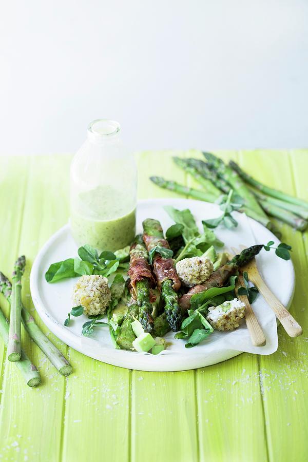 Green Asparagus Wrapped In Parma Ham With Goats Cheese Balls, Lemon And Herbs Photograph by Great Stock!